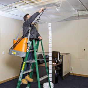 SpeedClean SC-CB Cassette Bib with bungees and a yellow bucket. This protective cover system is designed to contain water and cleaning solution when cleaning cassette-style HVAC units.