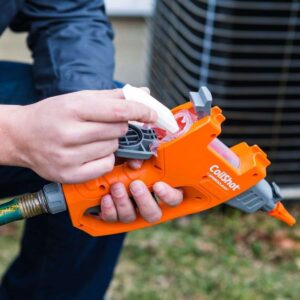 SpeedClean CoilShot SC-CS-100, a compact, water-powered condenser coil cleaner tool designed for efficient and thorough cleaning using specialized foam tablets.